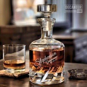 Personalized Beveled Blade lead-free crystal whiskey decanter with custom engraved Tilt angled script design, shown with matching whiskey glass.