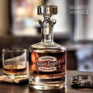Personalized Buckingham lead-free crystal whiskey decanter featuring custom logo engraving, shown with matching whiskey glass.