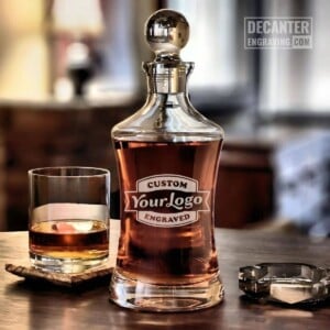 Hourglass Whiskey Decanter | Custom Logo Engraving 21 Personalized Hourglass crystal whiskey decanter featuring custom logo engraving, shown with matching whiskey glass.