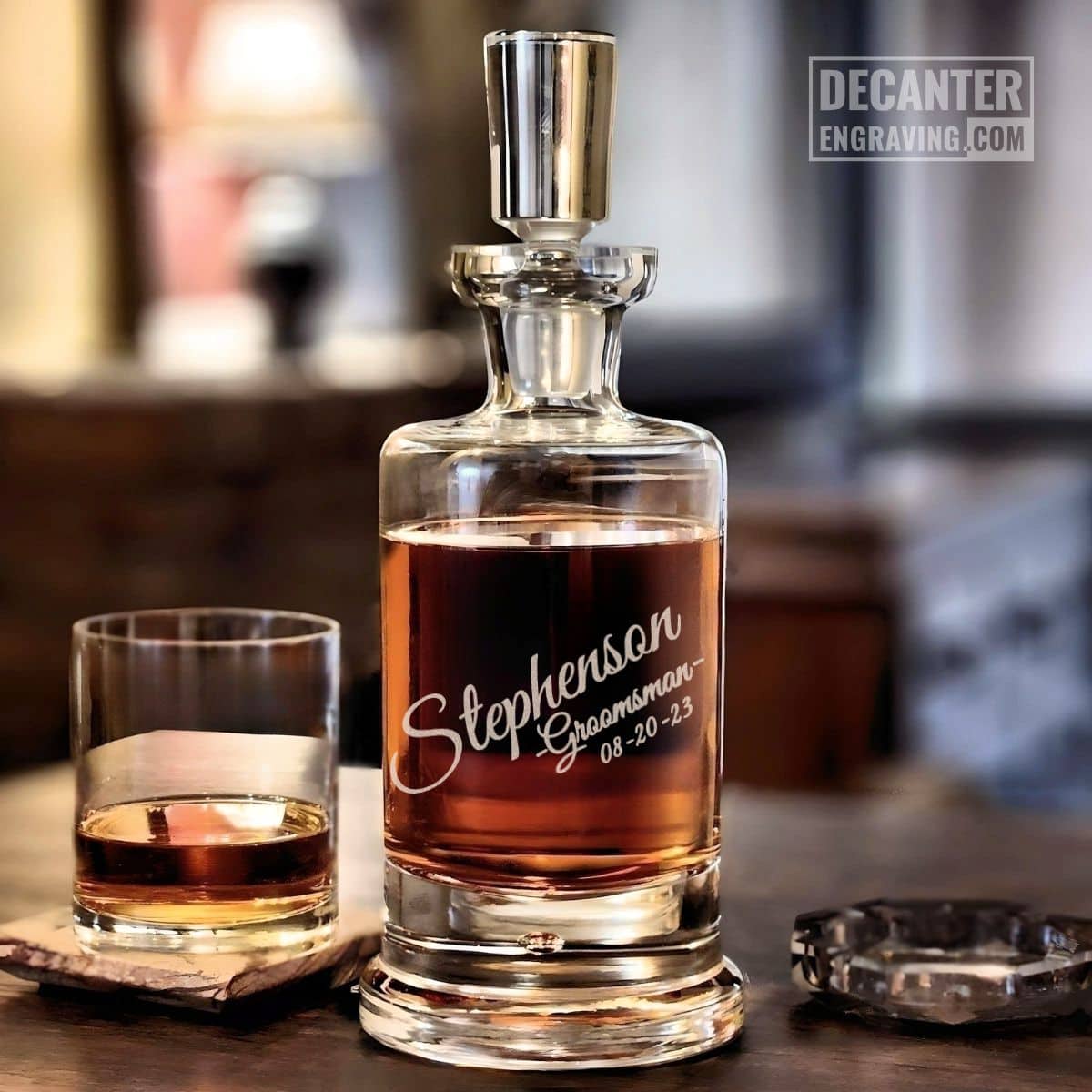 Personalized Kensington lead-free crystal whiskey decanter with custom engraved Tilt angled script design, shown with matching whiskey glass.