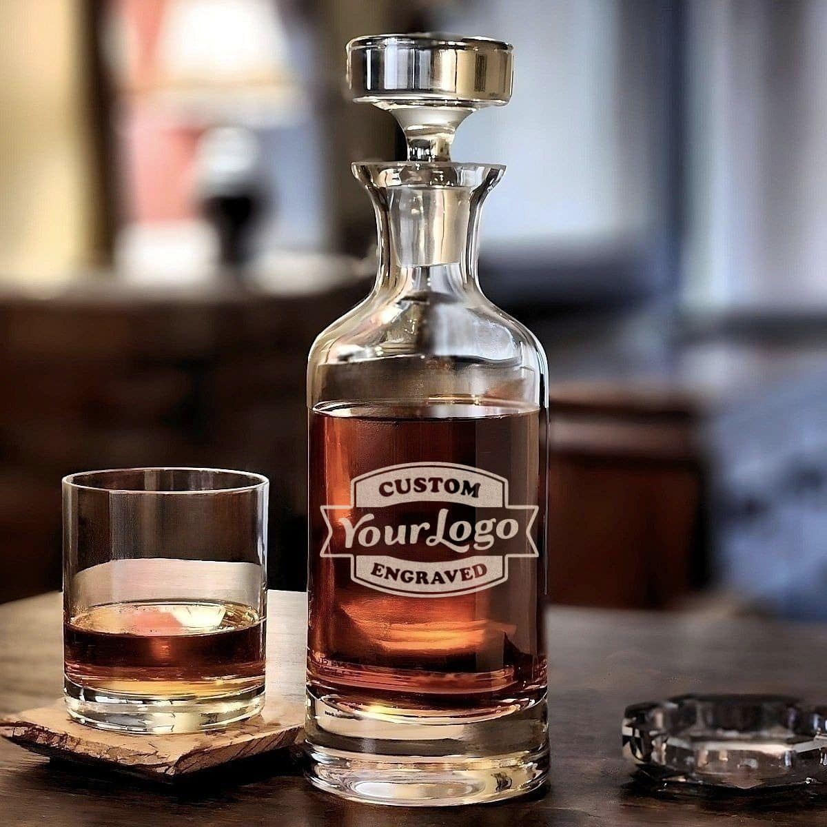Personalized Wellington lead-free crystal whiskey decanter featuring custom logo engraving, shown with matching whiskey glass.