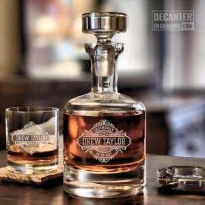 Personalized Buckingham lead-free crystal whiskey decanter with custom engraved Onyx reserve medallion design for gormmsman gift, shown with matching whiskey glass.