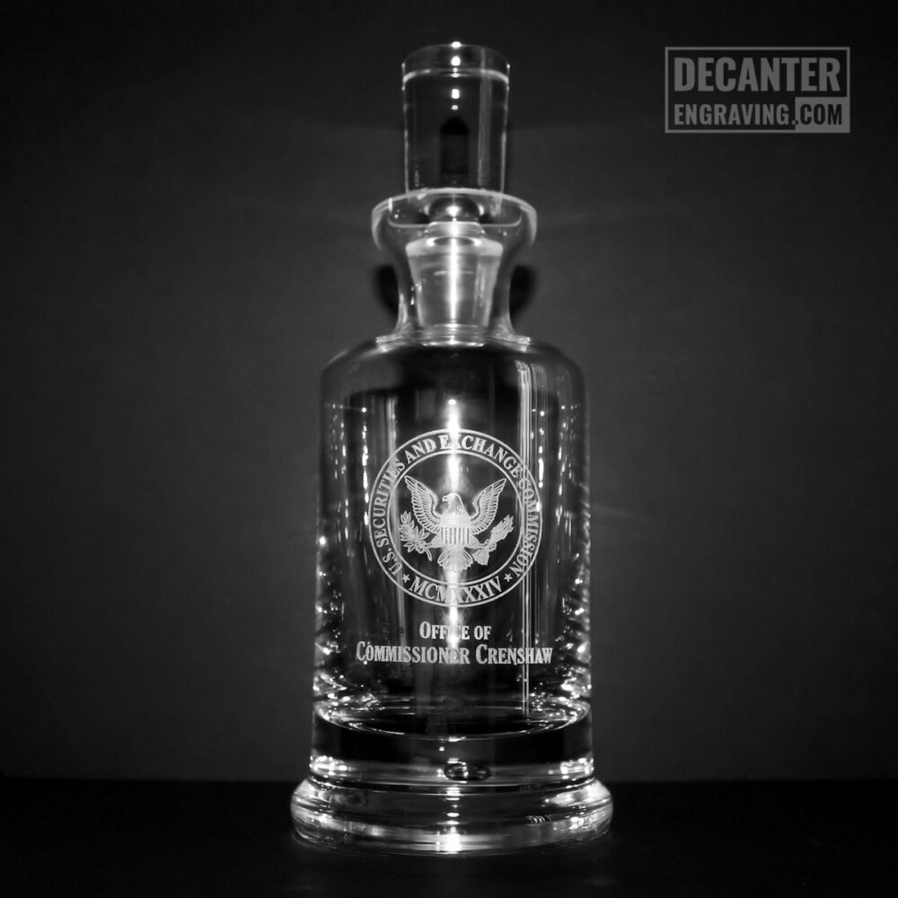 engraved whiskey decanter - kensington securities and exchange commission logo