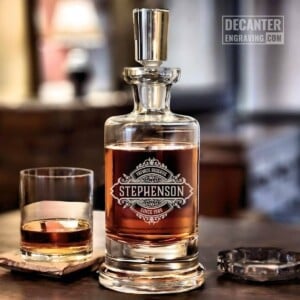 Kensington Whiskey Decanter | Onyx 17 Personalized Kensington lead-free crystal whiskey decanter with custom engraved Onyx reserve medallion design, shown with matching whiskey glass.