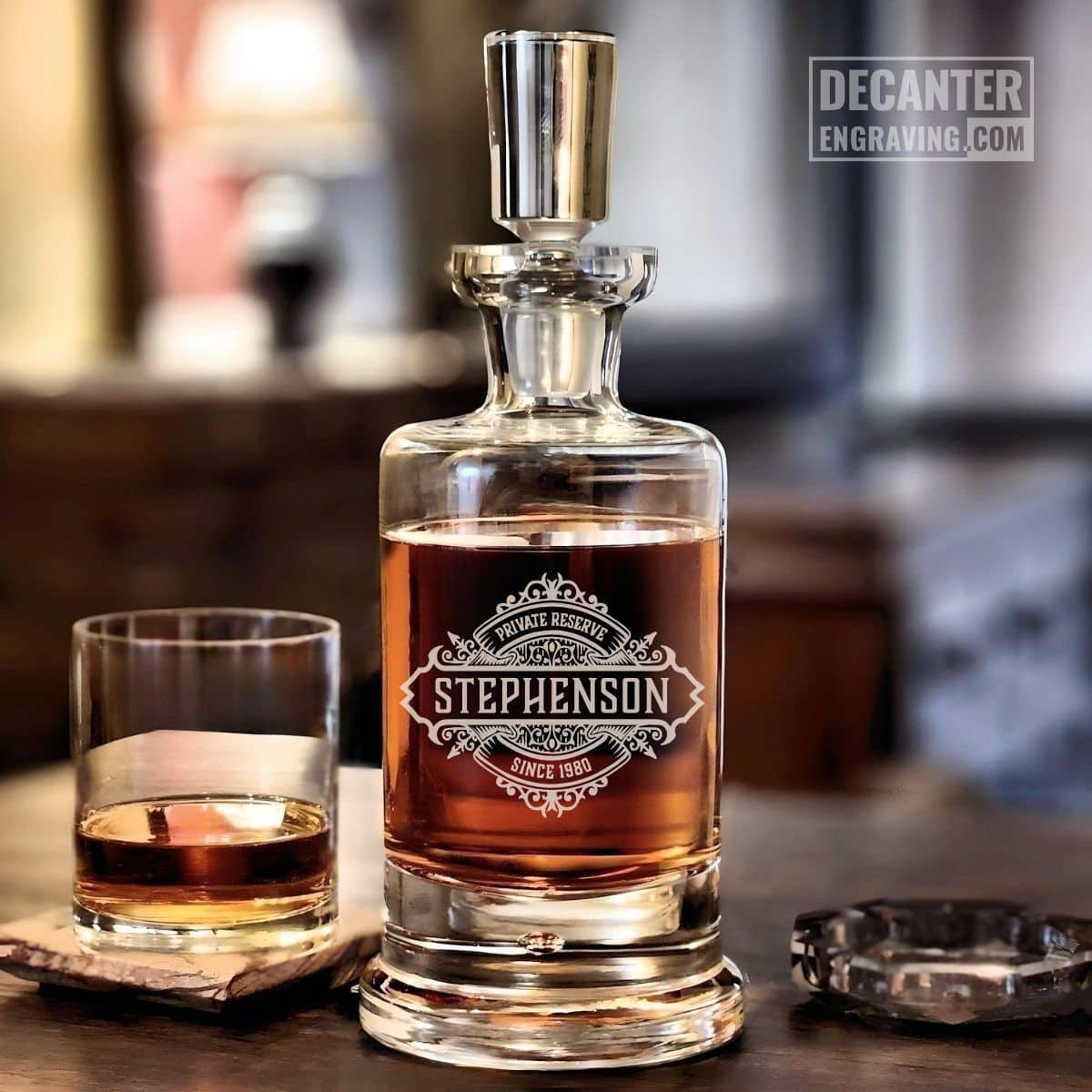 Personalized Kensington lead-free crystal whiskey decanter with custom engraved Onyx reserve medallion design, shown with matching whiskey glass.