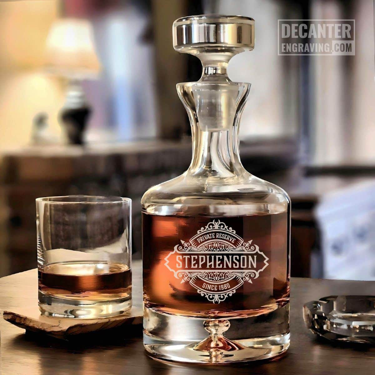Personalized Taylor lead-free crystal whiskey decanter with custom engraved Onyx reserve medallion design, shown with matching whiskey glass.