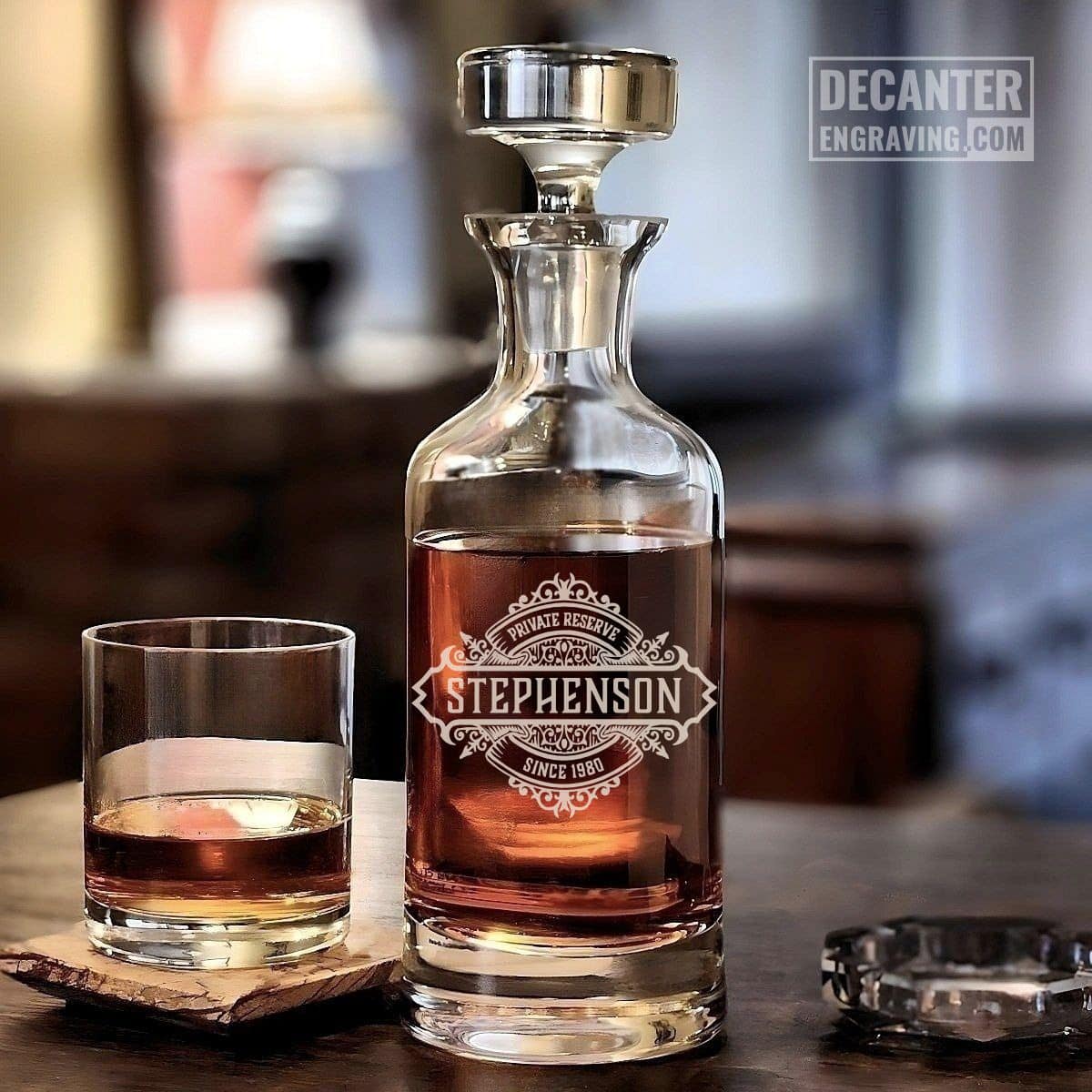 Personalized Wellington lead-free crystal whiskey decanter with custom engraved Onyx reserve medallion design, shown with matching whiskey glass.