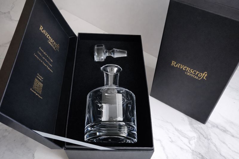 Premium gold-stamped gift box with silk-lined custom foam inserts designed exclusively for custom engraved crystal whiskey decanters.